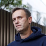 Russian opposition leader Navalny speaks with journalists outside a detention centre in Moscow