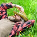 nature-is-my-home-rest-in-countryside-farmer-bearded-man-rest-after-day-work-farmer-relax-on-green-grass-ecology-concept-summer-vacation-united-with-motherland-eco-environment-summer-rest_474717-10528