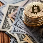 golden bitcoin on wood background